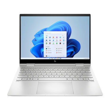 HP Envy 16 laptop in silver color with the screen displaying Windows desktop background, showing the keyboard and trackpad.