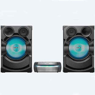 Sony SHAKE-X70D home audio system with two tall blue LED speaker towers and central media console