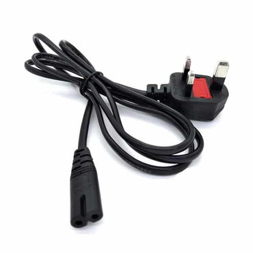 Black flower-style laptop power cord coiled neatly on desk