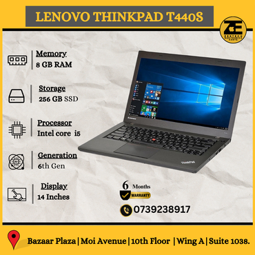 Lenovo ThinkPad T440s laptop with a black keyboard displayed on a surface, with its screen showing a Windows desktop background.