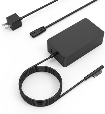 Compact Surface Pro charger with USB port on desk