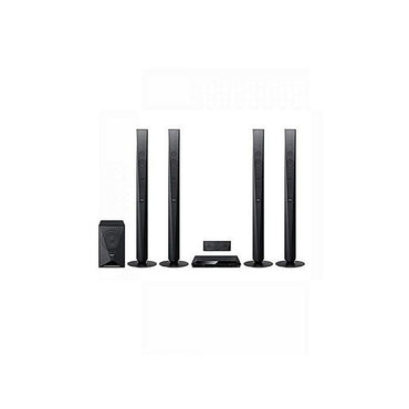 Sony DAV-DZ950 home theatre setup with four black tallboy speakers, DVD console, center bar, and sub