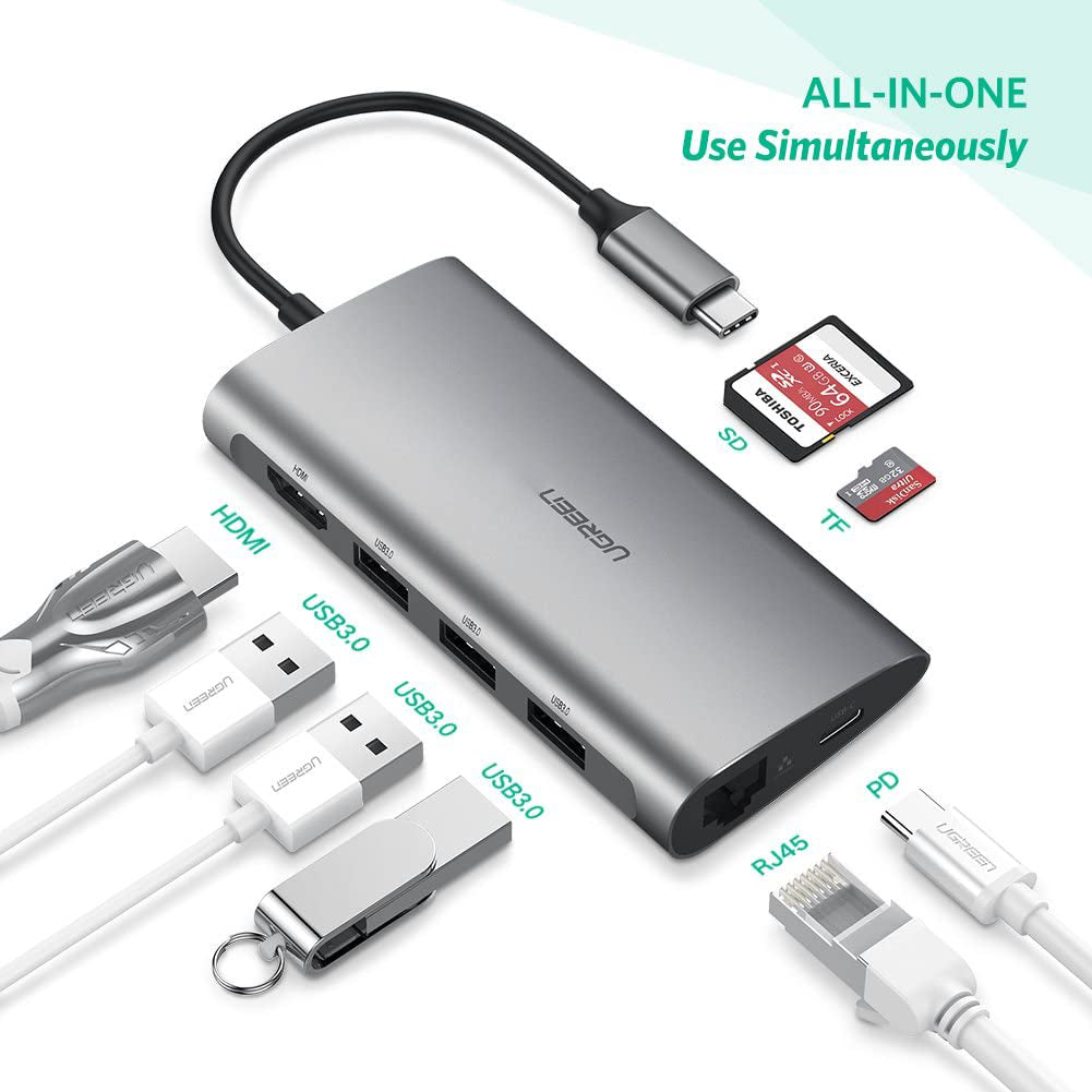 Portable 8-in-1 Type-C hub with multiple gadgets around it
