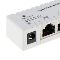 A white Generic Gigabit Power Over Ethernet (PoE) Injector with Ethernet ports and a power input jack.