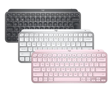 An image showing three Logitech MX Keys Mini wireless keyboards in pink, gray, and white colors, displayed in an overlapped fashion.