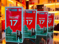 Official Redmi 17 retail boxes on a shop counter, showing the 7,500mAh 4G model