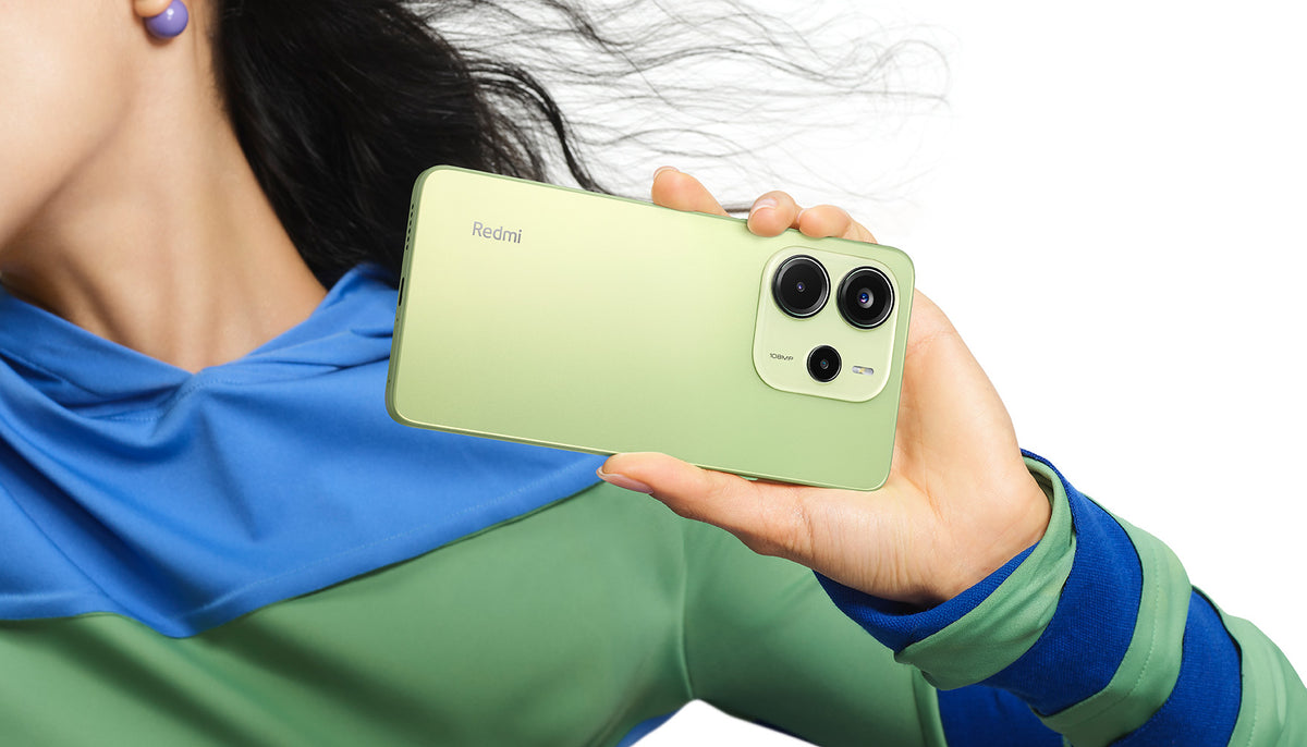 Redmi Note 14 in lime green, back and camera module against a white background
