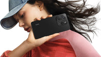 Redmi Note 14 in midnight black, back and 108MP camera island held in hand