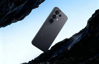 Tecno Camon 50 Pro in moonshadow black, back view on dark rock