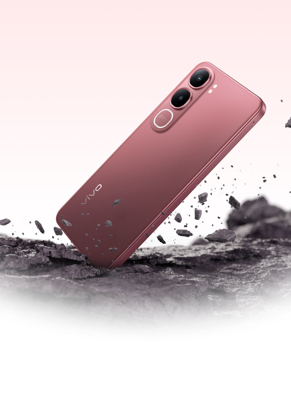 vivo Y21d Coral Red above a rocky surface, official durability shot of the sealed back
