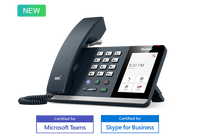 User operating the Yealink MP54 Teams Edition in a modern office